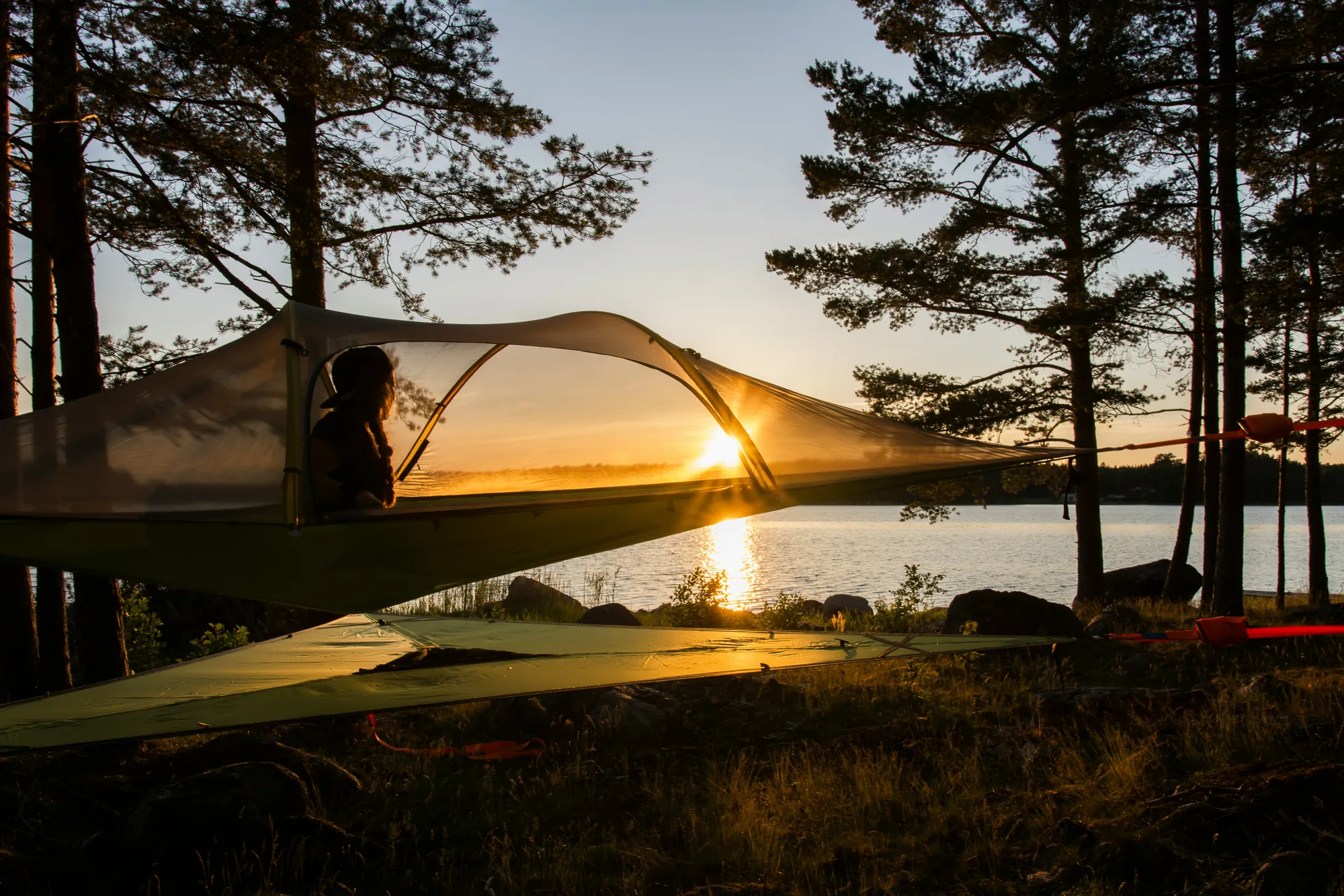 Cloth stretched over a frame outdoors at dusk